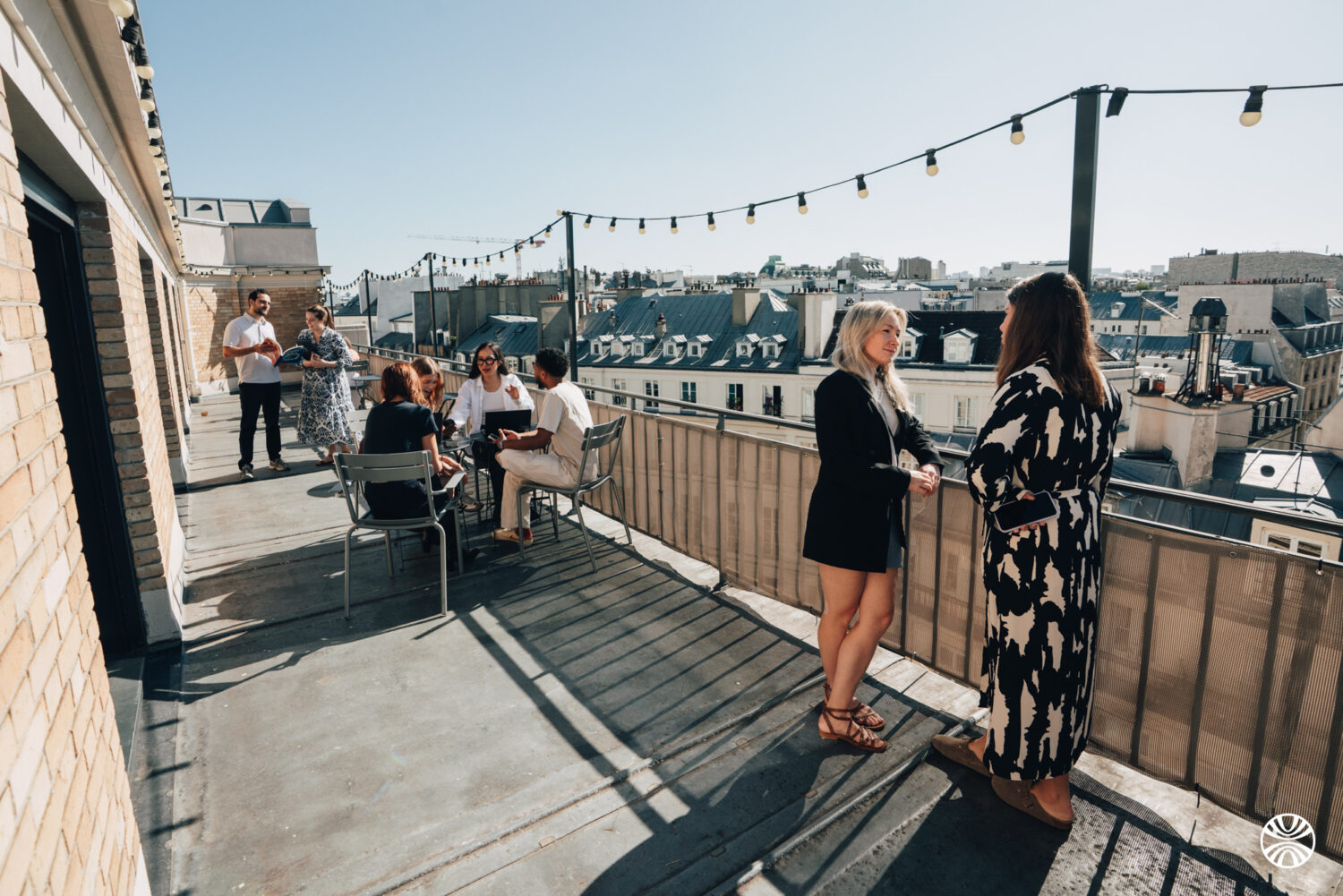 People on a rooftop in Paris, Hopscotch company