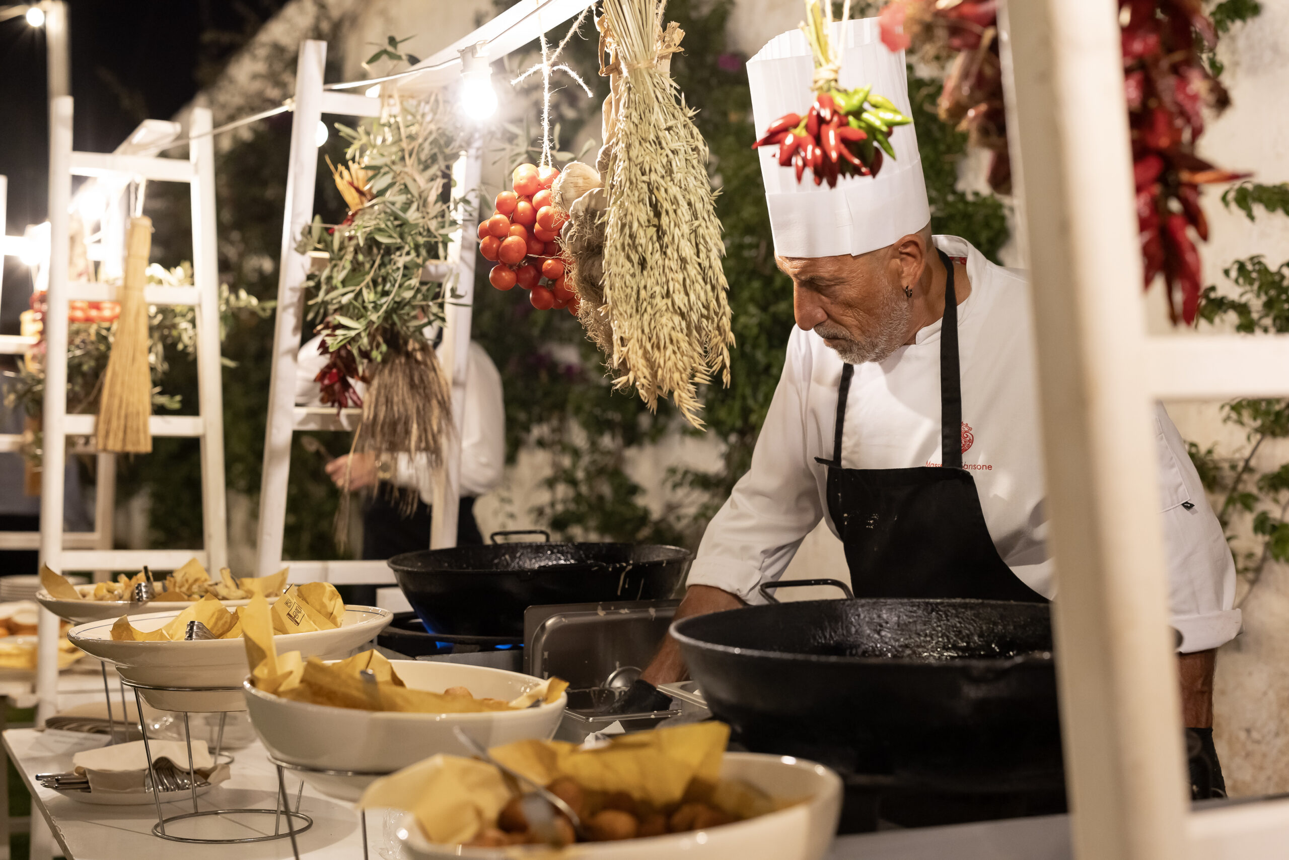 Celebrity chef cooking dinner at an exclusive event in Puglia, Italy