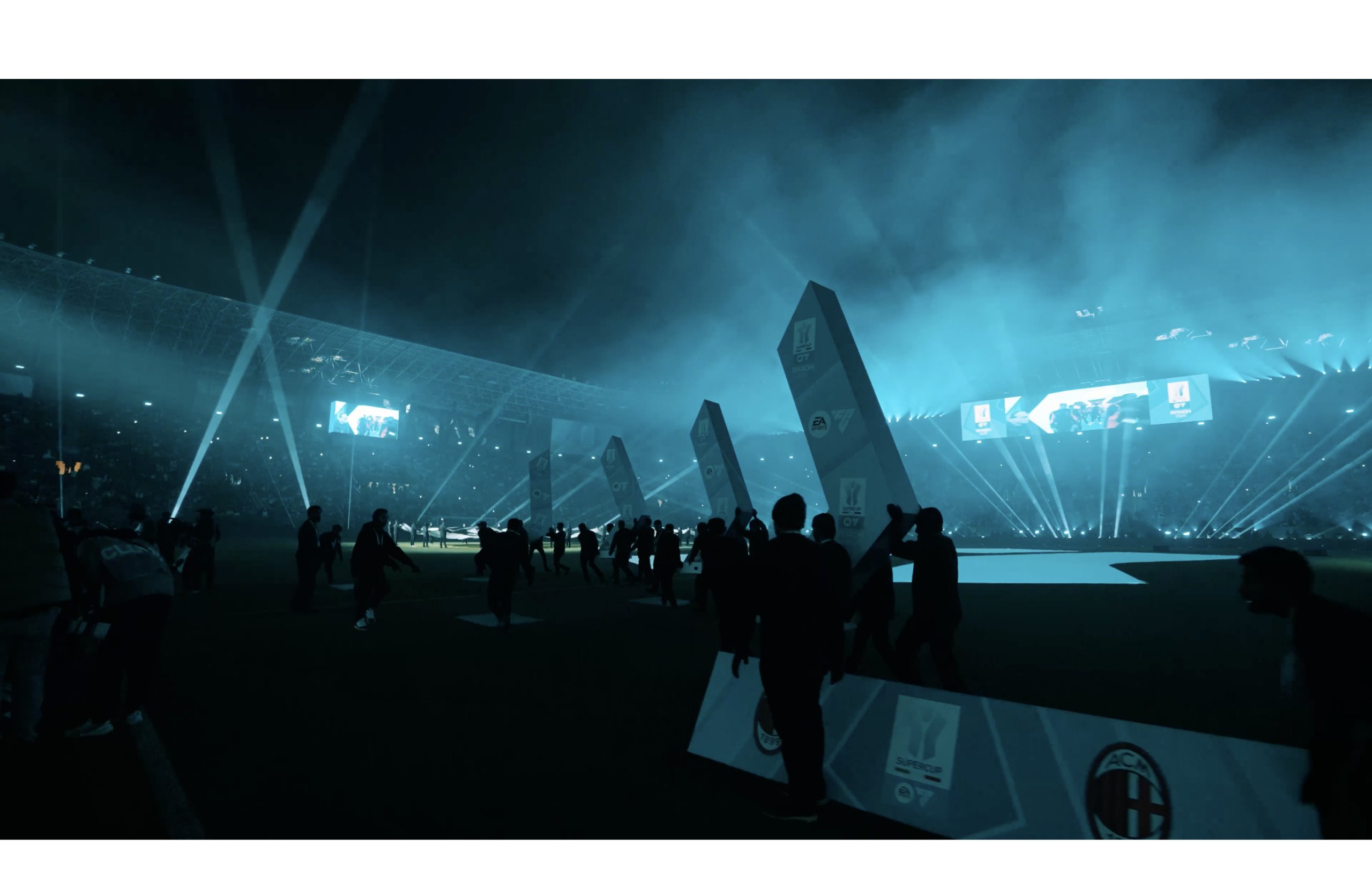 ceremony at a stadium at night with lightshow