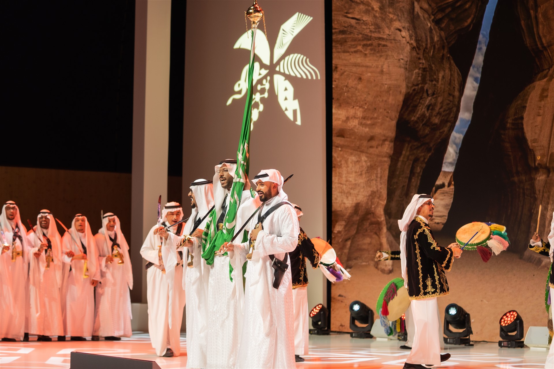 men on stage in tradition clothing